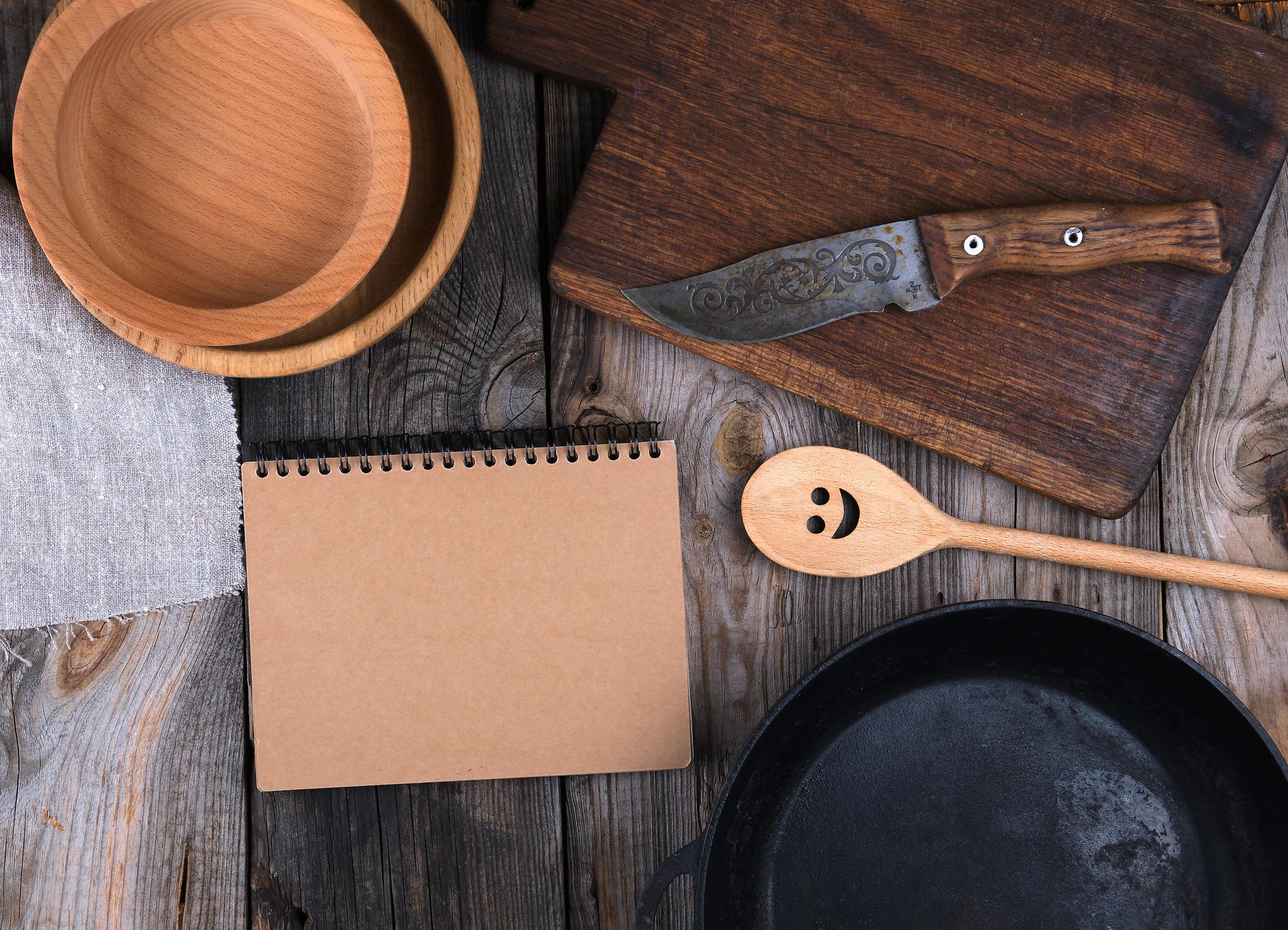 Notes and tasting spoons next to a recipe booklet