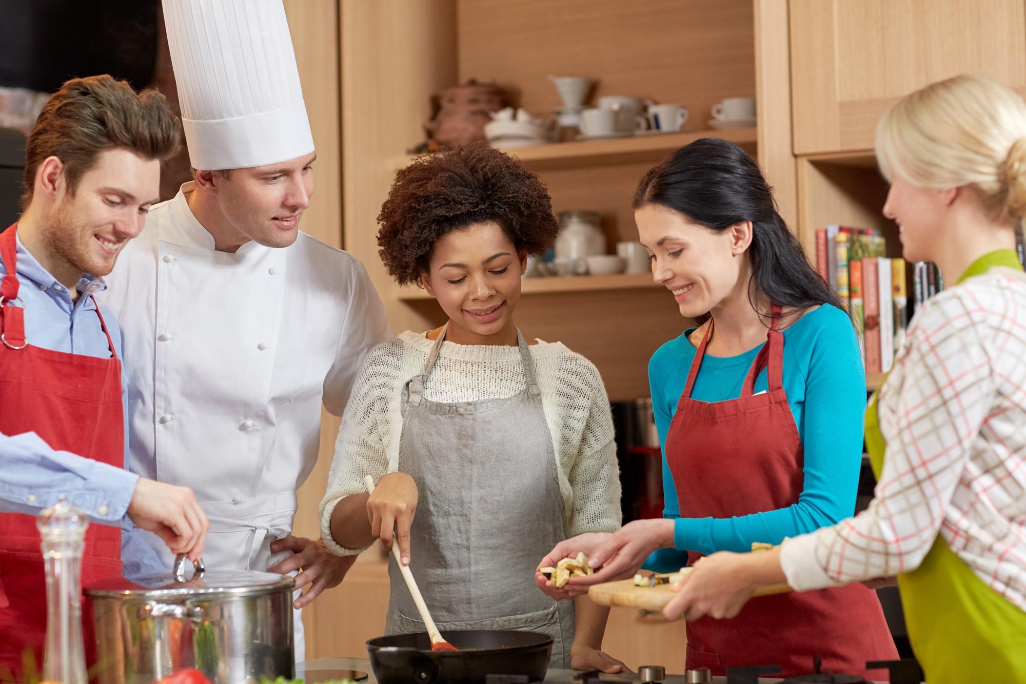 Small group cooking in a compact kitchen